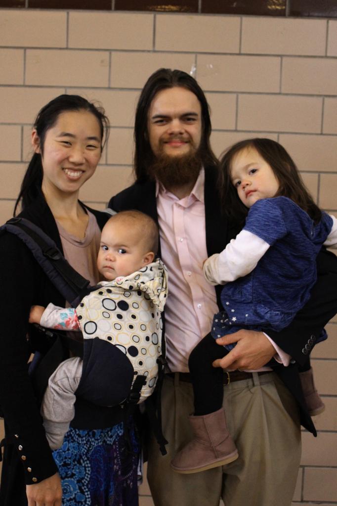 Elizabeth and Brendon Miller-Boldt (pictured with their two young children) also attend Latin Mass at Pittsburgh's Most Sacred Blood of Jesus parish and represent the tradition's new embrace by younger worshippers.