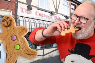 Cottage Bakery boss Paul Cook eats one of his "non-binary gingerbread people"