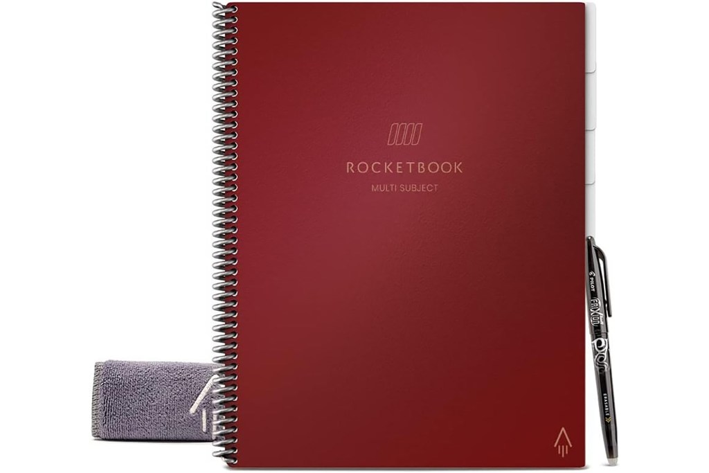 Maroon spiral notebook with pen and wiping cloth