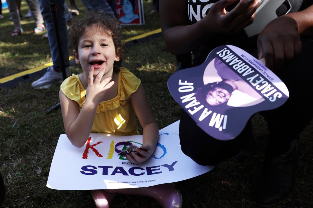 A young girl attends a rally for Stacey Abrams on Nov. 5 in Savannah, Ga.