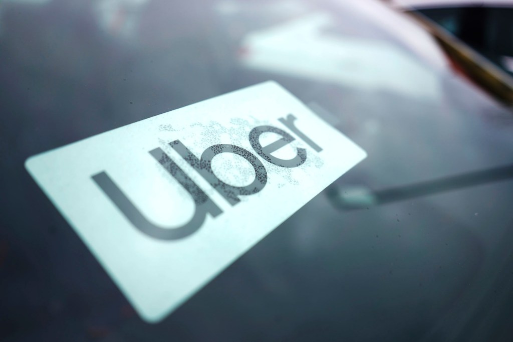 pictured is an Uber logo on a windshield