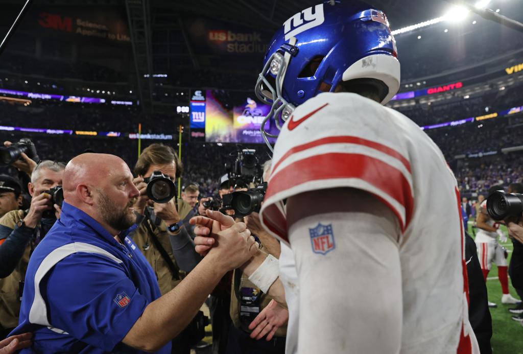 Daniel Jones is greeted by Brian Daboll after the Giants' win over the Vikings on Jan. 15.