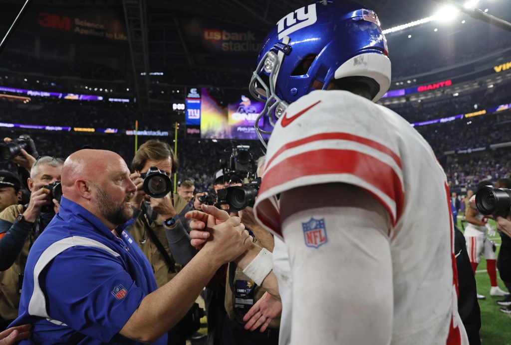 Daniel Jones is greeted by Brian Daboll after the Giants' win over the Vikings on Jan. 15. 