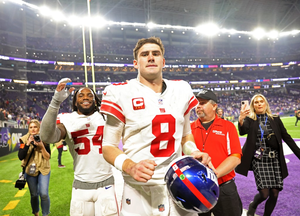 Daniel Jones celebrates after beating the Vikings.