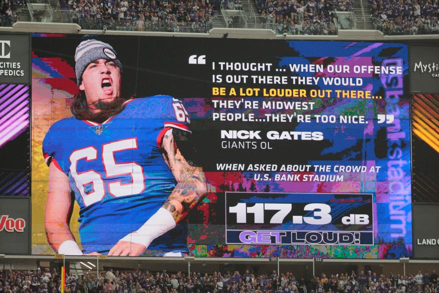 The Minnesota Vikings try to use a statement by Nick Gates #65 of the New York Giants to fire up the crowd during the first quarter.