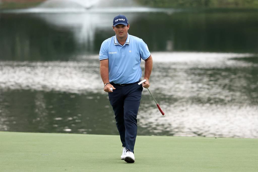 Patrick Reed walks on the green during the Dubai Desert Classic's opening round.