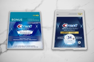 Two boxes of Crest White Strips on a white marble background.