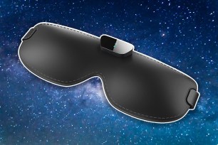 Black eyemask on a background of the night sky.