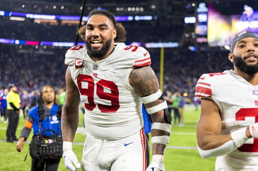 New York Giants defensive end Leonard Williams (99) celebrates after they win the NFC Wild Card game against the Minnesota Vikings at U.S. Bank Stadium Sunday, Jan. 15, 2023, in Minneapolis, MN.