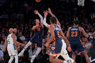 New York Knicks guard Jalen Brunson #11 puts up a shot during the second quarter.