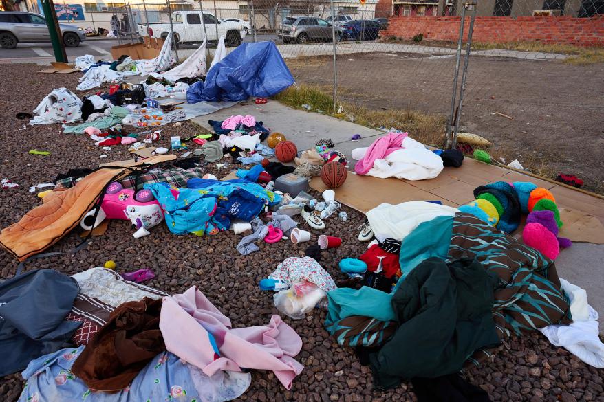 The belongings of a Honduran family with five children at their encampment across from Sacred Heart Church are in disarray.