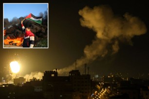 Fire and smoke rise above buildings in Gaza City, as Israel launched air strikes on the Palestinian enclave early on Jan. 27, 2023.