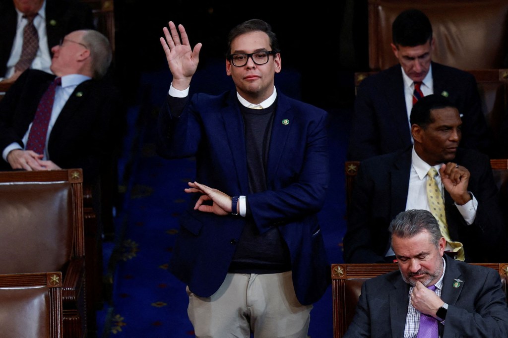 Rep. George Santos makes a gesture with his left hand as he casts a vote for Rep. Kevin McCarthy as House speaker on Jan. 5. 