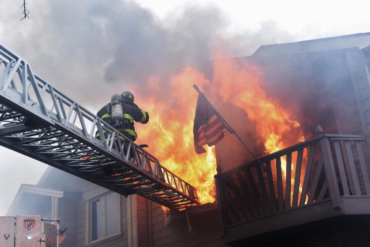 FDNY firefighters fight back flames at a Friday fire in Staten Island.