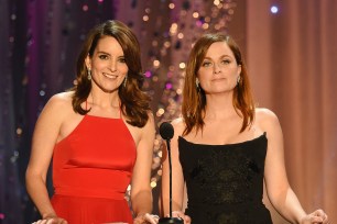 Tina Fey and Amy Poehler present at an awards show together.