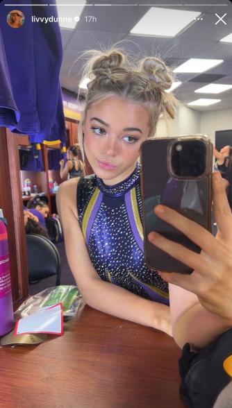 Olivia Dunne poses in a mirror during LSU v. Florida meet.