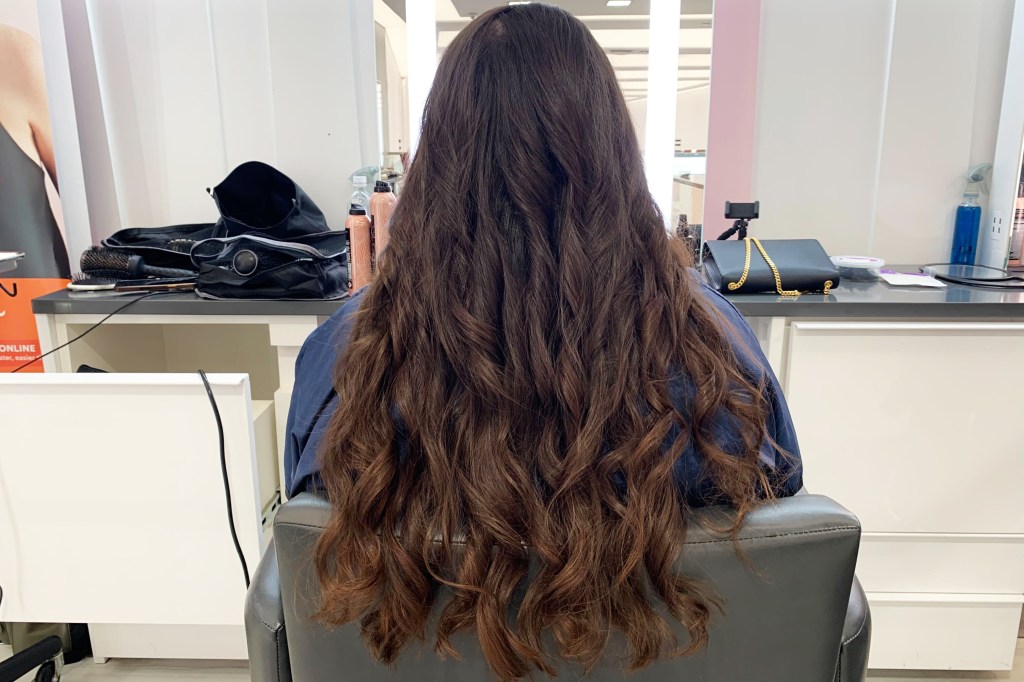 A head of brown curled hair
