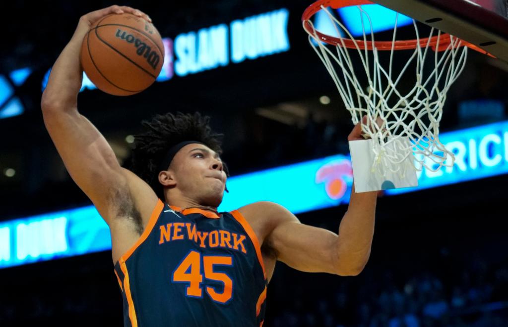 Knicks center Jericho Sims slams one home during the Slam Dunk Contest.