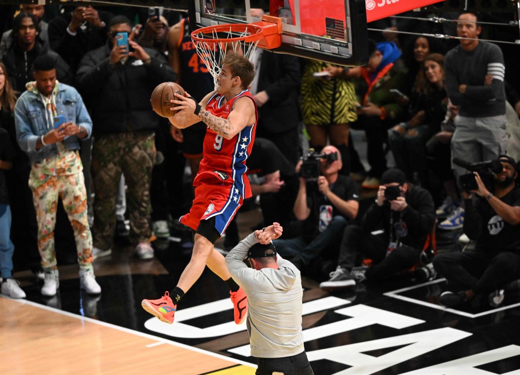 The 76ers' Mac McClung slams home one of his many winning dunks en route to winning the Slam Dunk Contest.