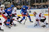 Mika Zibanejad (right) scores the game-winning goal in the Rangers' 4-3 win over the Canucks.