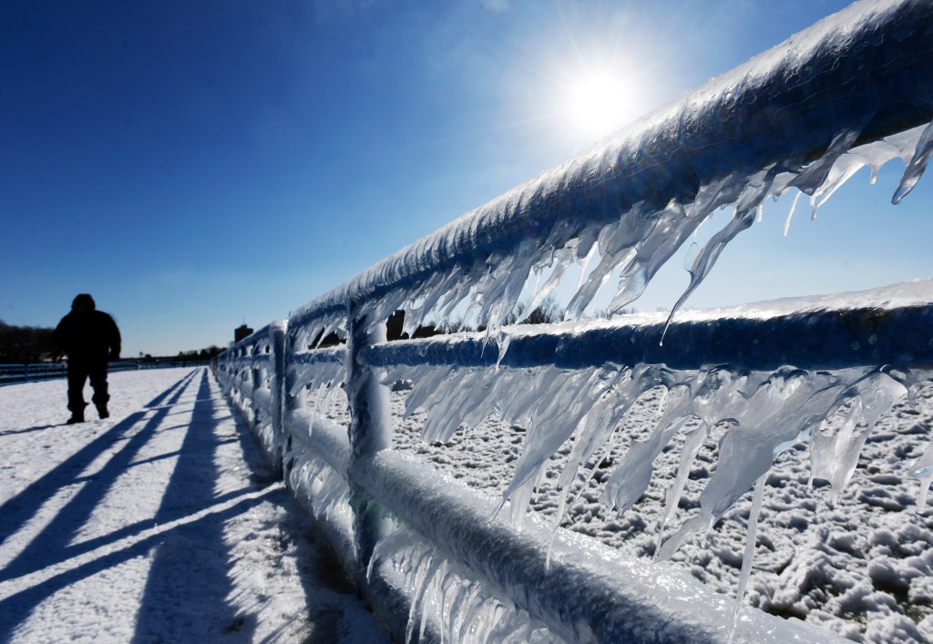 Ice forms along the railings of the south pier in St. Joseph, Mich.