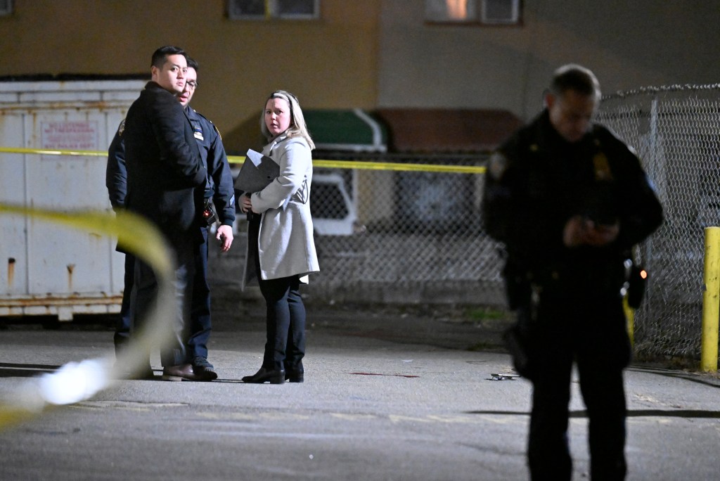 Investigators are seen at the scene of the shooting, 472 Ruby Street in East New York.