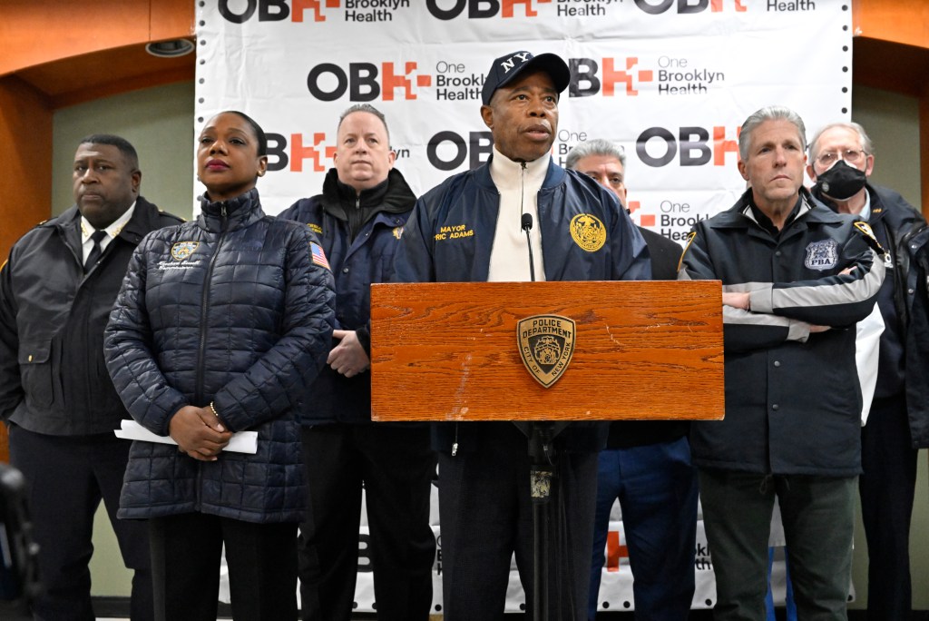 Mayor Eric Adams is flanked by Police Commissioner Keechant Sewell, Chief of Department Jeffrey Maddrey, PBA President Patrick Lynch and other officials at a press conference about the wounded officer.