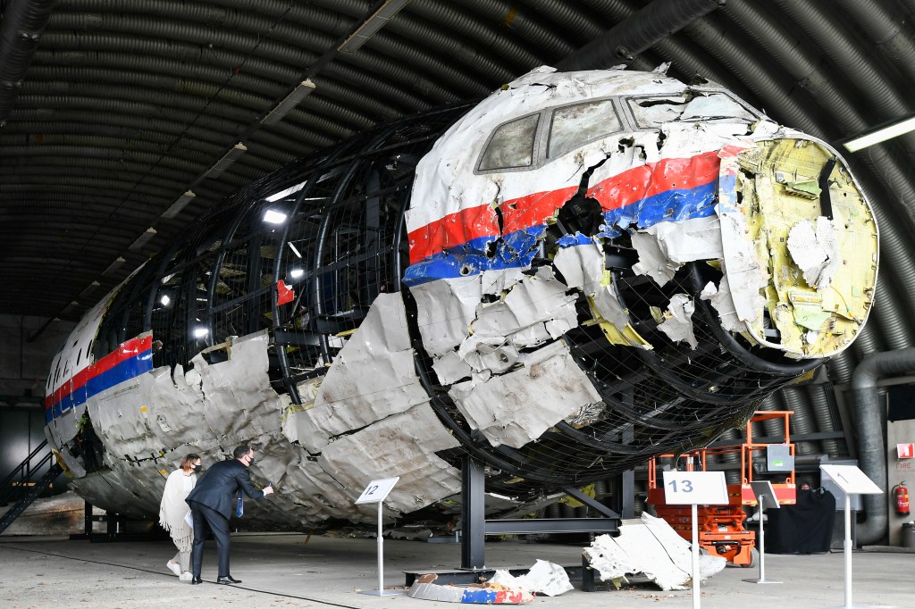 Lawyers attend the judges' inspection of the reconstruction of the MH17 wreckage, as part of the murder trial ahead of the beginning of a critical stage, in Reijen, Netherlands, May 26, 2021. 