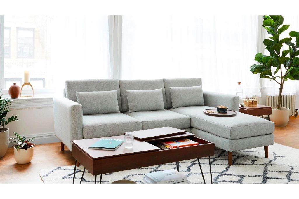 White rug with navy blue pattern in a living room.