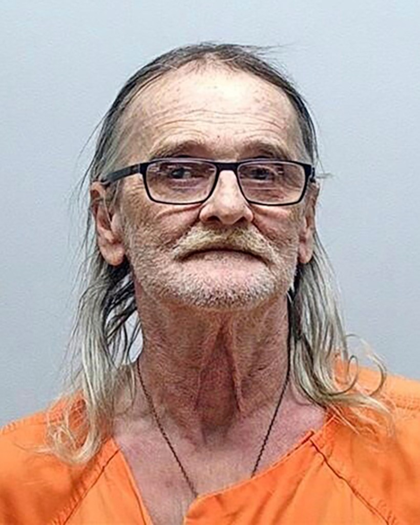 Mugshot of John Wayne Lehman. He is wearing an orange jumpsuit and has stringy, long grey hair and glasses.