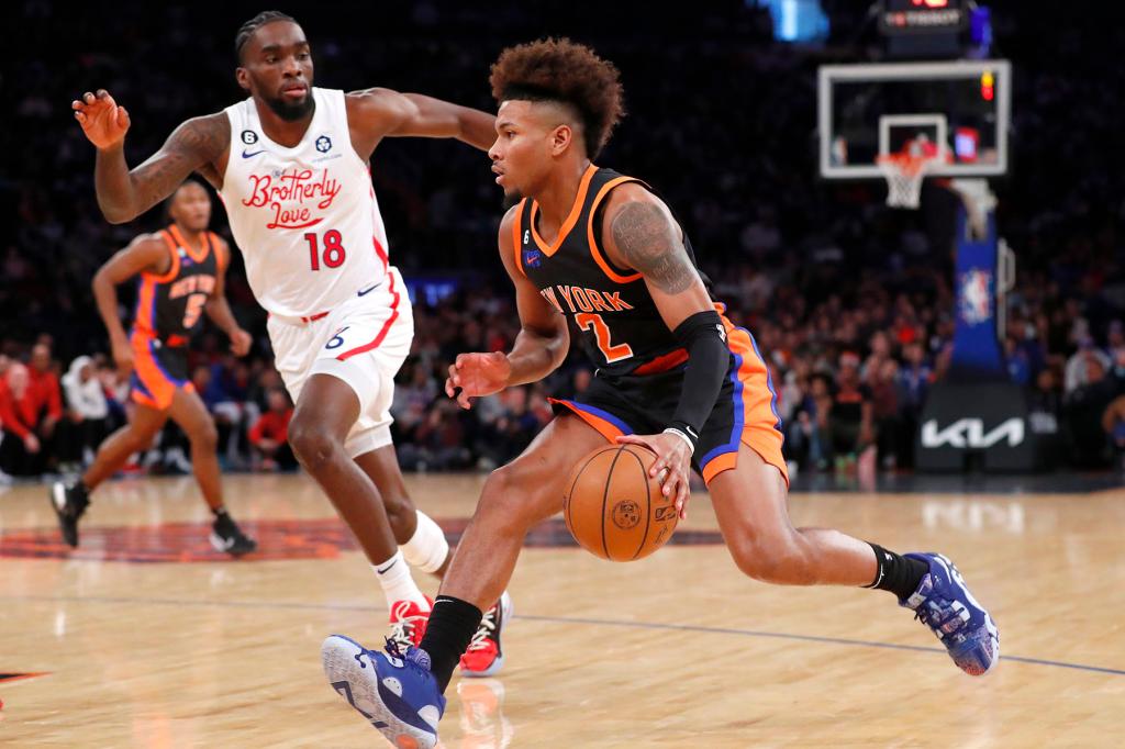New York Knicks guard Miles McBride (2) drives down court as Philadelphia 76ers guard Shake Milton (18) defends during the first half at Madison Square Garden in New York. Sunday, Dec. 25, 2022.