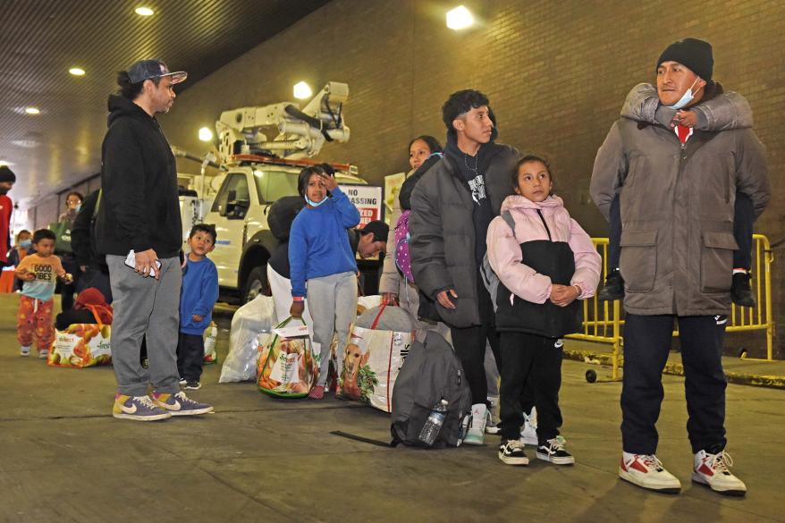 Migrants arrive at the Port Authority Bus Terminal on a bus from Texas.