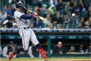 Twins star Carlos Correa takes a swing.