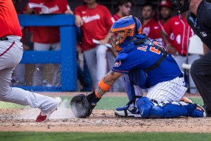 Francisco Alvarez stops a ball in the eighth inning of the Mets' 11-6 spring training loss to the Nationals.