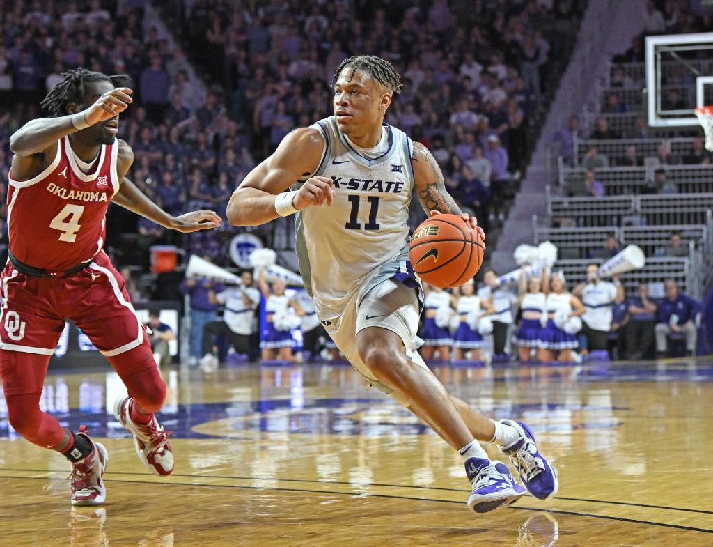 Keyontae Johnson of the Kansas State Wildcats drives to the basket against Joe Bamisile of the Oklahoma Sooners during a game in the second half at Bramlage Coliseum.