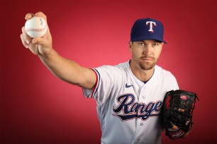 Rangers starter Jacob DeGrom demonstrates a pitch.