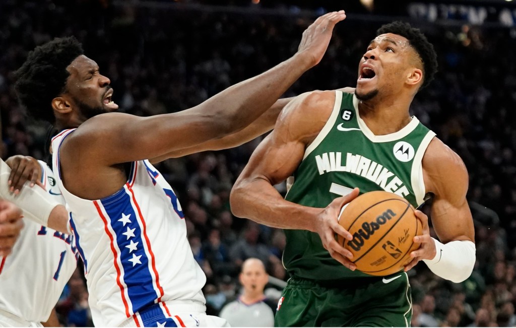 Giannis Antetokounmpo, who scored 34 points, drives on Joel Embiid during the Bucks' loss.