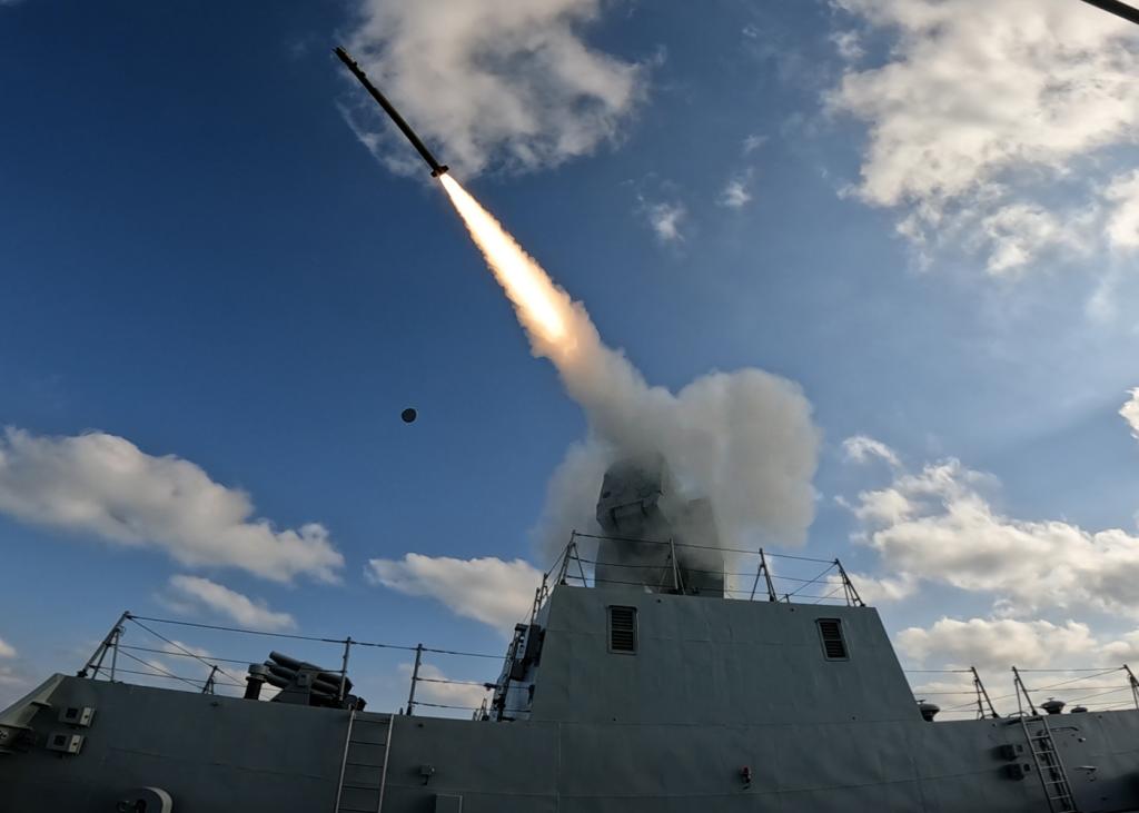 A missile is fired from an aircraft carrier