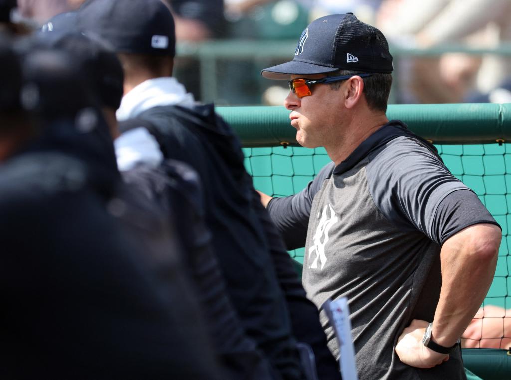 Aaron Boone looks on from the dugout during the Yankees' spring training game against the Rays on Feb. 28.