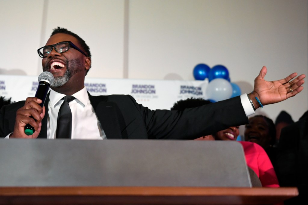 Cook County Commissioner Brandon Johnson celebrates