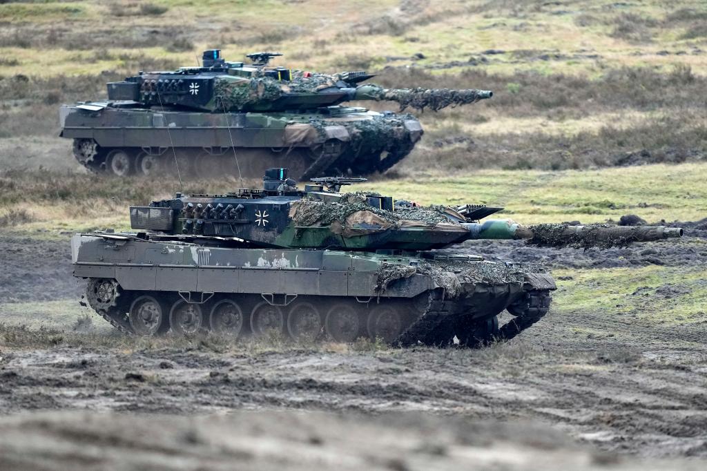 Two Leopard 2 tanks are seen in action at the Field Marshal Rommel Barracks in Augustdorf, Germany, Wednesday, Feb. 1, 2023.