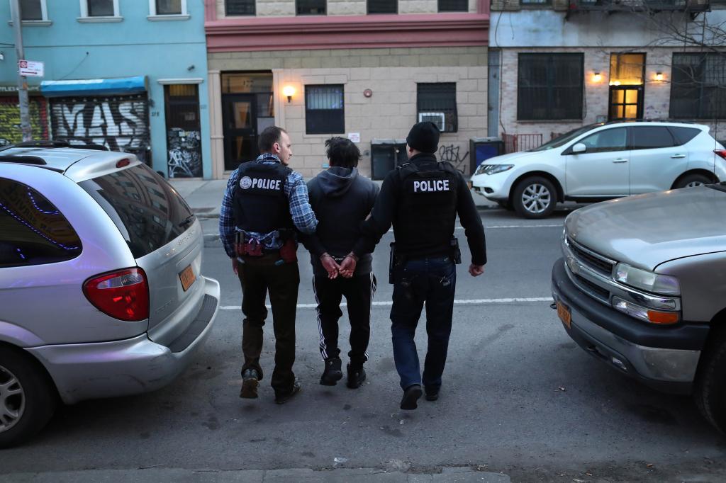 Immigration and Customs Enforcement (ICE), officers arrest an undocumented Mexican immigrant during a raid in the Bushwick neighborhood of Brooklyn on April 11, 2018.