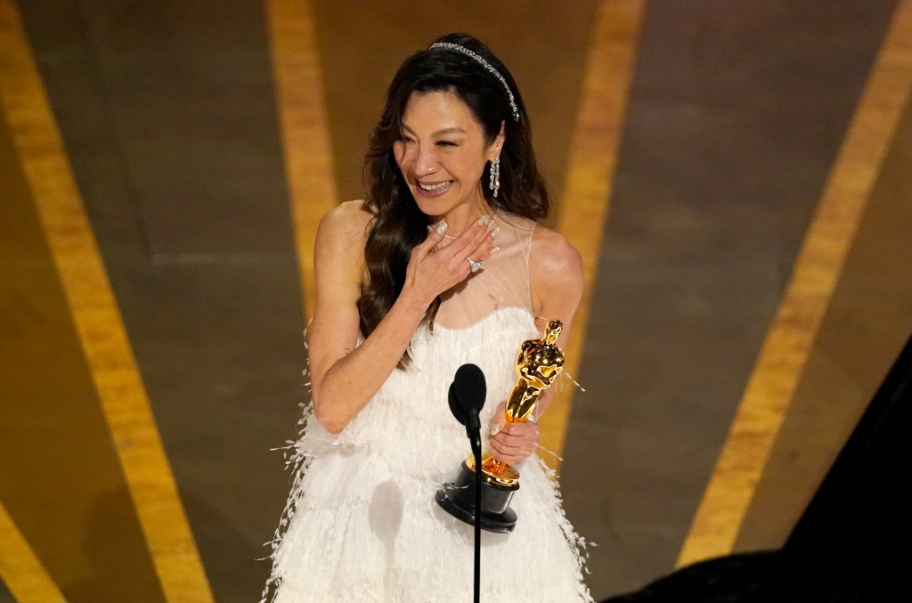 Michelle Yeoh accepts the award for best performance by an actress in a leading role for "Everything Everywhere All at Once" at the Oscars on Sunday, March 12, 2023, at the Dolby Theatre in Los Angeles. 