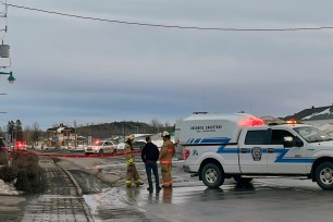 Police at the scene of where two people were killed and nine injured after getting struck by a van in Amqui, Quebec on March 13, 2022.