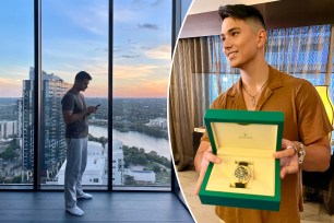 Young millionaire in apartment and holding rolex