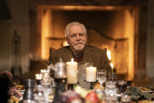 Brian Cox sits at the head of a table in "Succession."