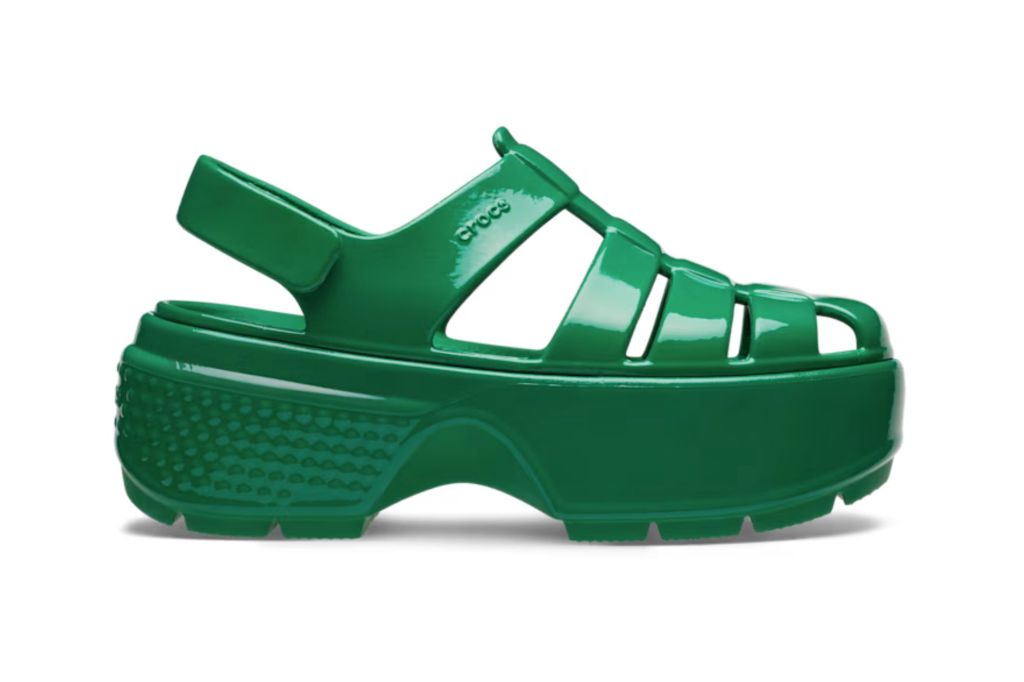 A green jelly Crocs sandal for women.