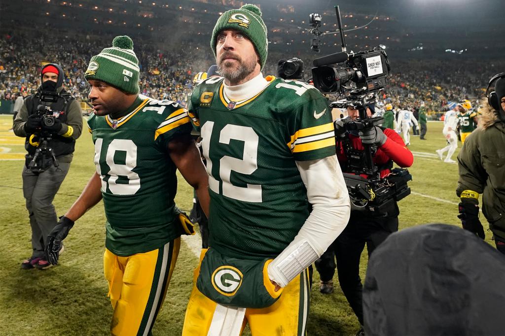 Aaron Rodgers (12) walks off the field following a Packers loss in January 2023.