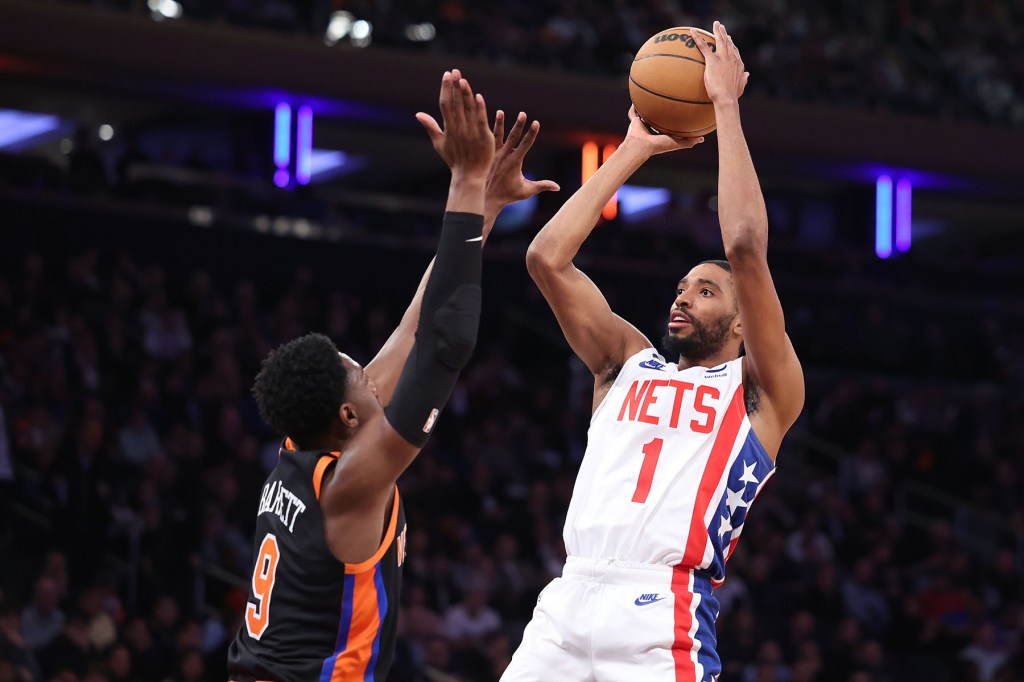 Mikal Bridges #1 of the Brooklyn Nets puts up a shot as RJ Barrett #9 of the New York Knicks defends during the second half when the New York Knicks defeated the Brooklyn Nets 142-118 Wednesday, March 1, 2023 at Madison Square Garden in Manhattan, NY.