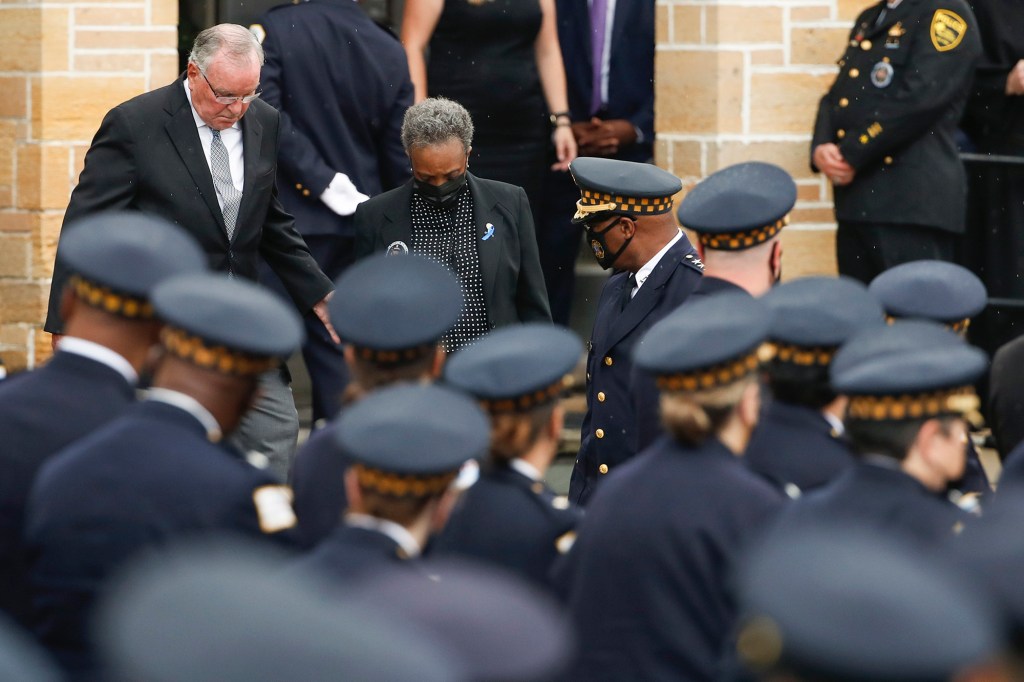 Former Chicago mayor Richard M. Daley (L), and Mayor Lori Lightfoot leave the funeral service for Chicago police officer Ella French at the St. Rita of Cascia Shrine Chapel on August 19, 2021.